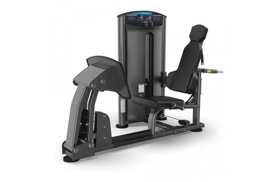 Black commercial leg and calf press machine with padded seat and footplate on white background