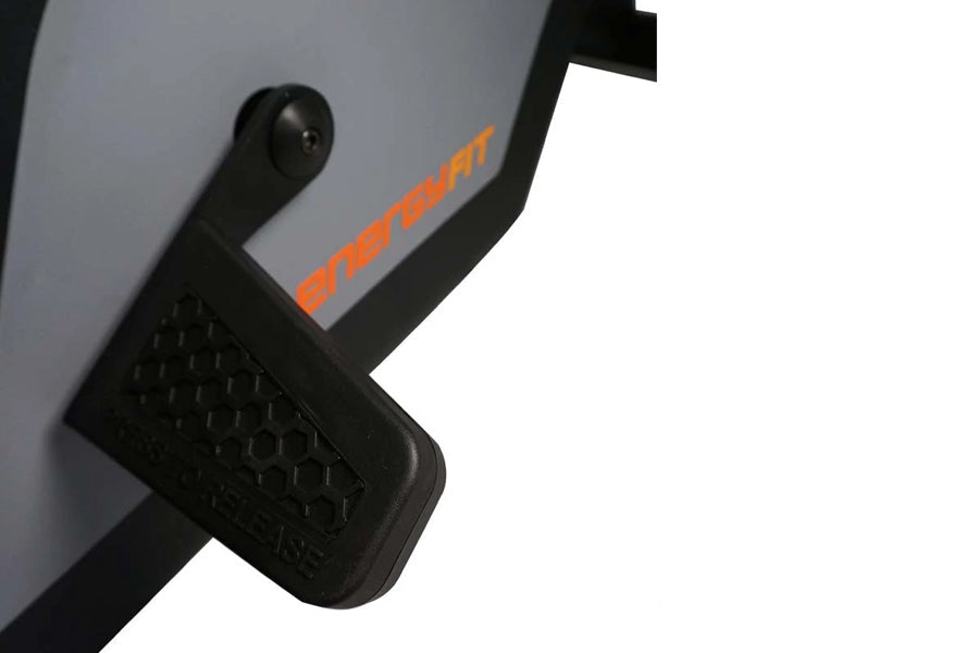 Black and gray rowing machine footrest with orange SKI-ROW branding on frame detail