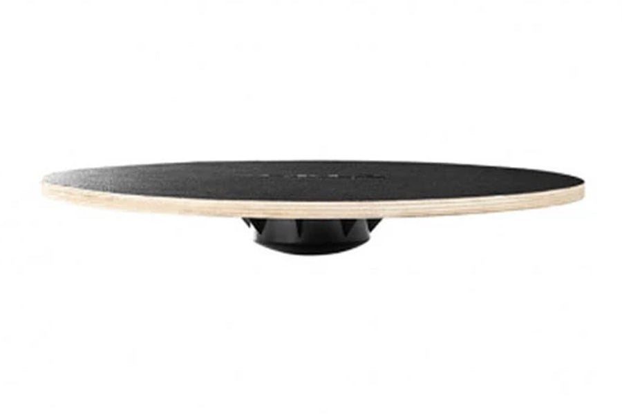 Sklz Balanz Board Pro with black textured surface and natural wood edge, mounted on black rocker base