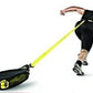 Male athlete in black sleeveless tank and shorts using black and neon yellow resistance training sled in dynamic sprinting mo