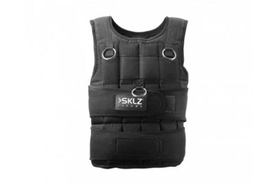 Black SKLZ weighted training vest with quilted padding, adjustable straps, metal D-rings, and front pocket on white backgroun