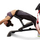 Woman demonstrating abdominal stretches on black and pink LifeSpan SP1000 Stretch Partner Pro machine with leg extension, on 