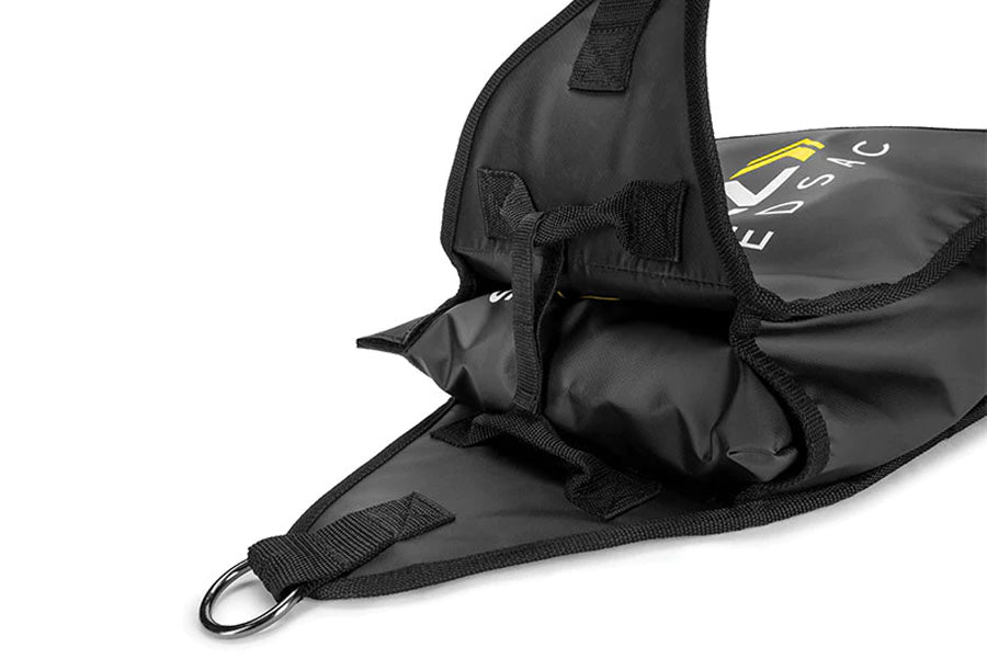 Black nylon training sac with mesh ventilation panels, carrying strap, and metal D-ring attachment on white background