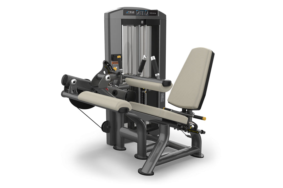 TRUE SPL-0200 seated leg curl machine with beige padded seat and backrest, black frame, on white background
