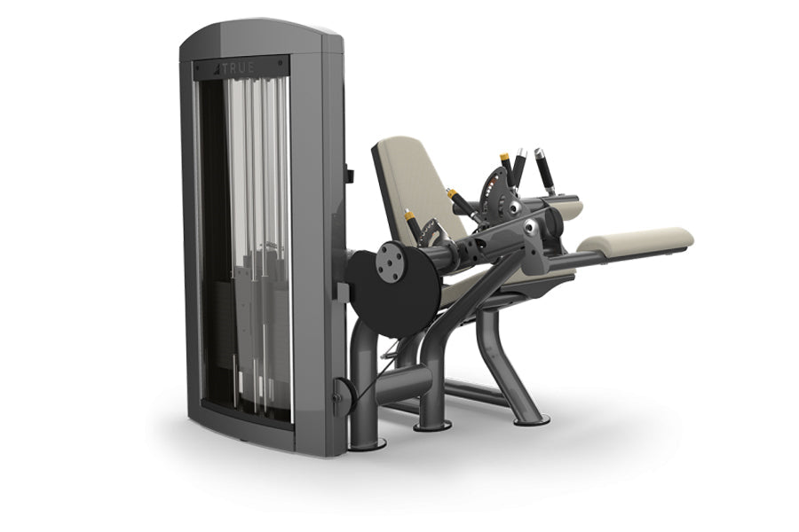 TRUE SPL-0200 seated leg curl machine with gray frame, black padding, and silver handles on white background