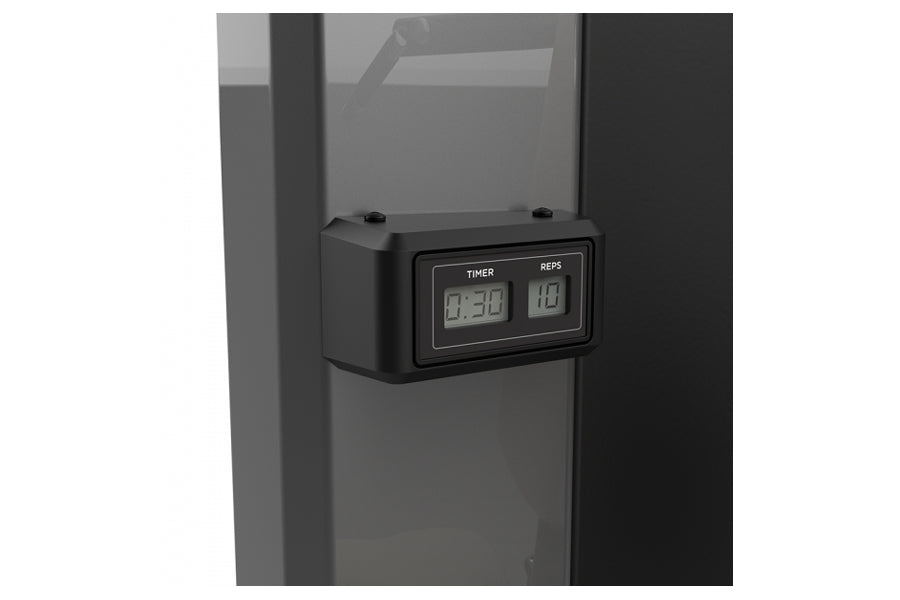 Black digital timer and rep counter with LCD display mounted on gray equipment frame