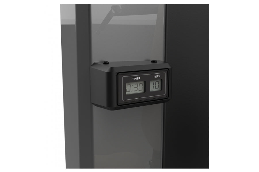 Black digital timer and rep counter display mounted on gray exercise equipment frame