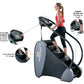 Woman in pink tank top using black and gray StairMaster Stairway GTL StepMill with labeled features including low step height