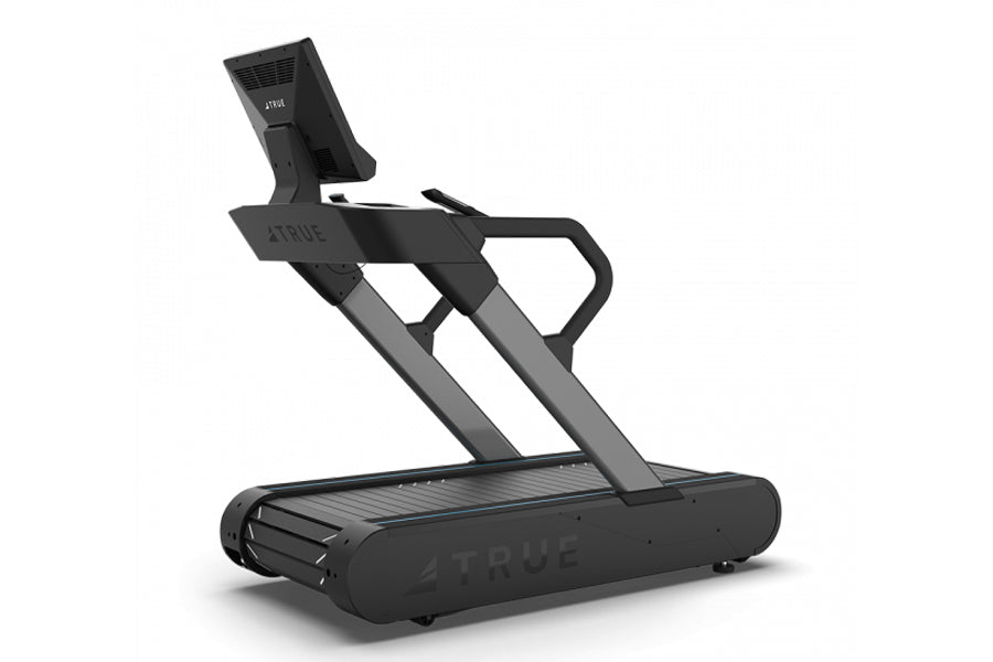 Black and gray TRUE Stryker commercial treadmill with slat belt, digital display, and dual handles on white background