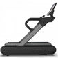 Black and gray TRUE Stryker Slat Treadmill with curved running surface and digital display console on white background