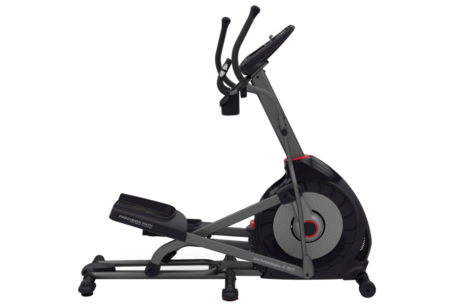 Schwinn 430 elliptical machine with black frame, gray flywheel, red accents, and dual handles on white background