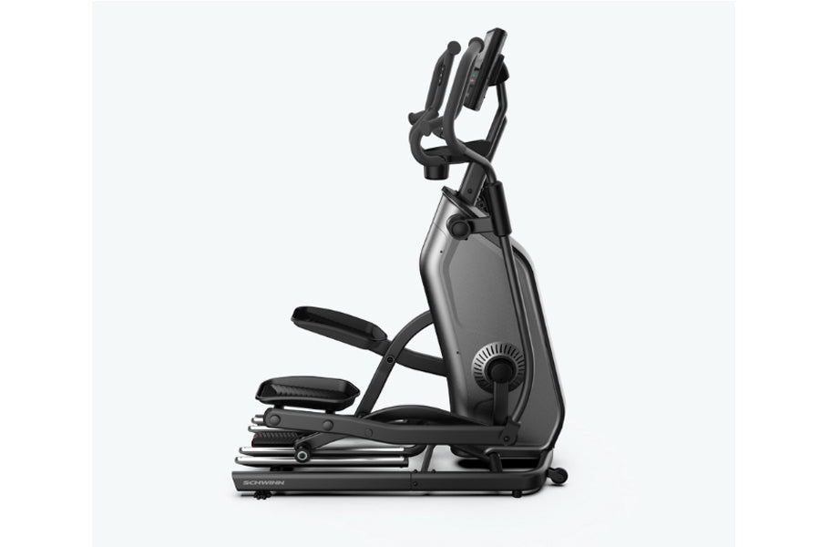 Schwinn 490 elliptical machine with gray and black frame, dual moving handles, and foot pedals on white background