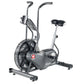 Schwinn Airdyne AD6 stationary exercise bike with gray frame, black seat, dual handles, and large fan wheel on white backgrou