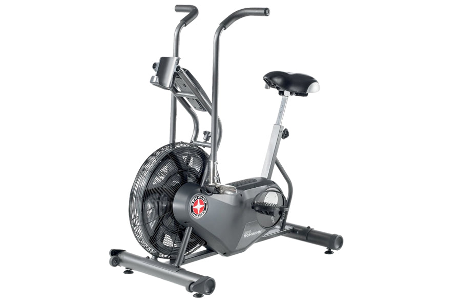 Schwinn Airdyne AD6 stationary exercise bike with gray frame, black seat, dual handles, and large fan wheel on white backgrou