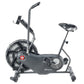 Schwinn Airdyne AD6 stationary exercise bike with gray frame, large black fan wheel, handlebars, and adjustable seat on white