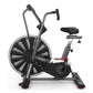 Schwinn Airdyne AD7 stationary exercise bike with large black fan wheel, black frame, padded seat, and dual handlebars on whi