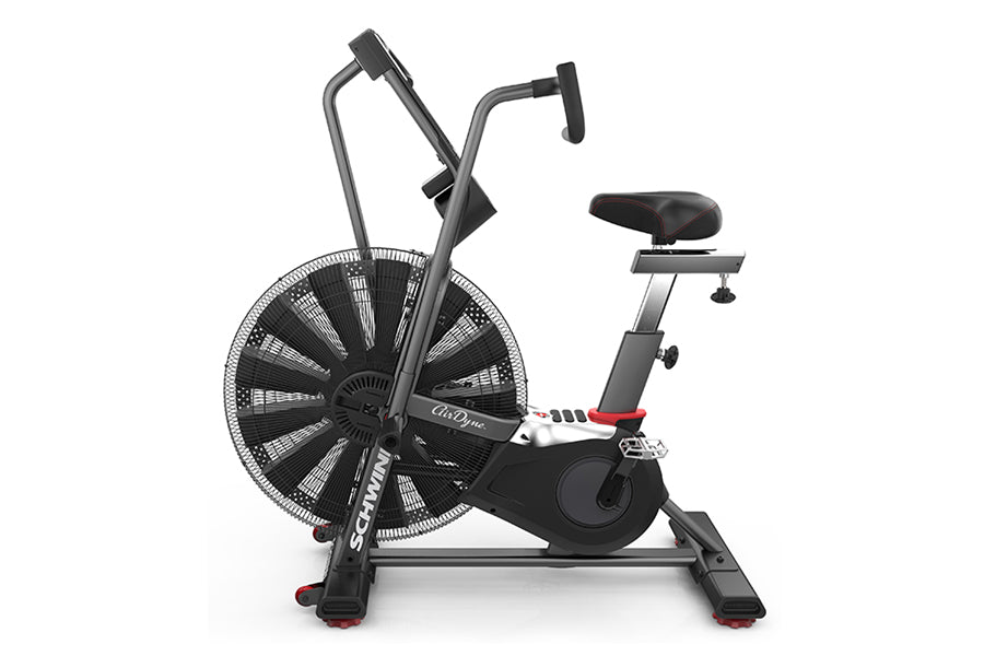 Schwinn Airdyne AD7 stationary exercise bike with large black fan wheel, black frame, padded seat, and dual handlebars on whi