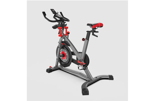 Schwinn IC4 indoor cycling bike with gray frame, red accents, and padded seat on white background