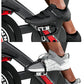 Black and gray cycling shoes with velcro straps on stationary bike pedals, shown in two styles