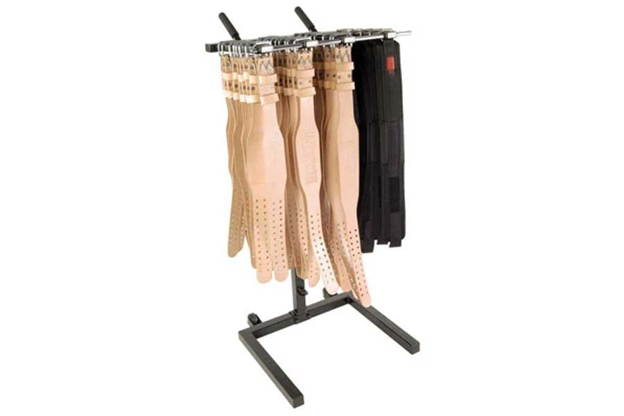 Four hosiery and tights hanging on black metal display rack with tripod stand, including nude mesh, dotted, and black styles 