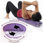 Woman lying on purple convex foam roller demonstrating abdominal exercise, wearing burgundy tank and black capris