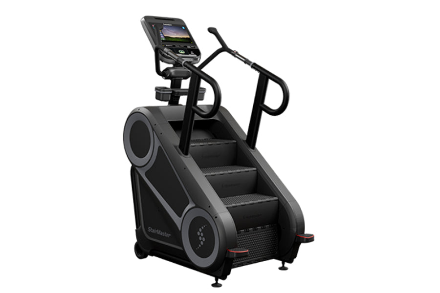 Black StairMaster 8Gx Gauntlet stair stepper with digital console, dual handles, and stepped climbing platform on white backg