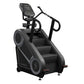 StairMaster 8Gx Gauntlet black stair stepper with digital console, handrails, and stepped platform on white background