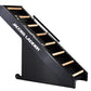 Black Jacobs Ladder climbing machine with wooden steps and side rails on white background
