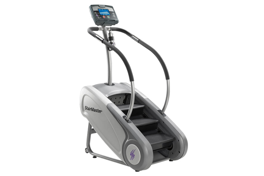 StairMaster SM3 StepMill with digital display console and black handlebar grips on white background