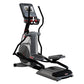 Star Trac 8CT elliptical cross trainer with gray and black frame, digital display console, and dual foot pedals on white back
