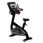 Black and gray upright exercise bike with red accents, digital console display, and adjustable seat on white background