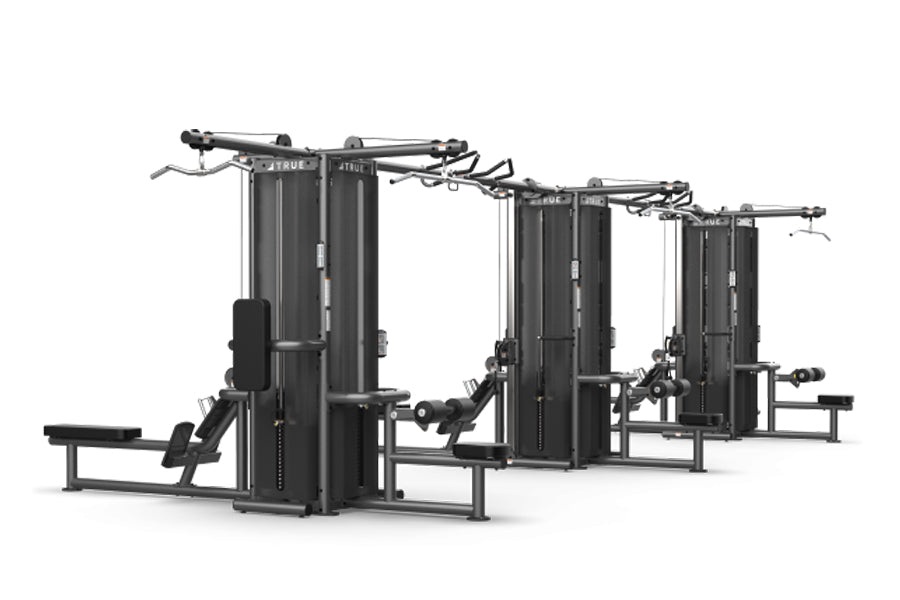 TRUE TMS12000 dual modular frame with cable crossovers and leg press attachments on white background