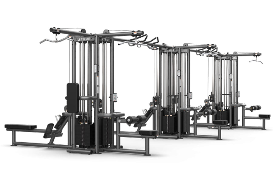TRUE TMS12000 dual modular frame with cable crossovers, black and chrome multi-station gym equipment on white background