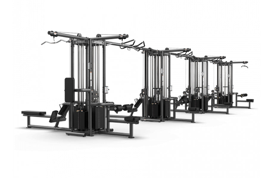 TRUE TMS16000 4 modular black exercise frames with cable crossover systems and leg press attachment on white background