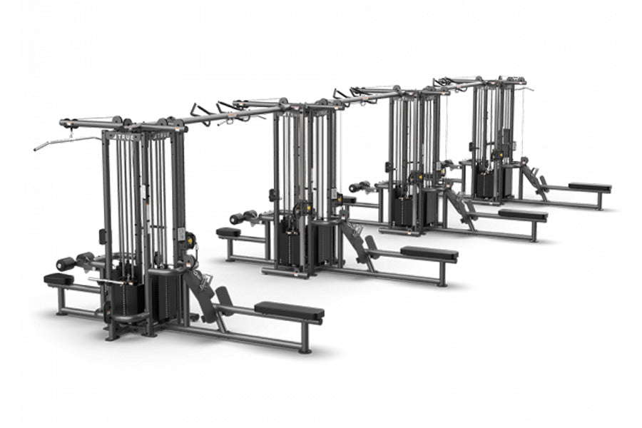 TRUE TMS16000 modular multi-station cable crossover system with four black frames featuring cable machines and benches on whi