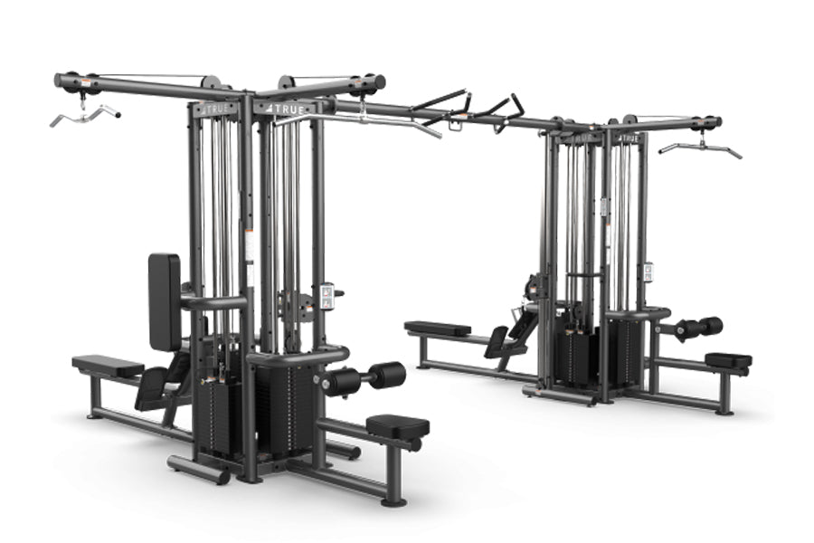 TRUE TMS8000 dual modular frame with black steel construction, cable crossovers, and multiple workout stations on white backg