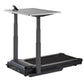 Black desk treadmill with gray rectangular work surface, adjustable dual columns, and integrated treadmill belt base on white