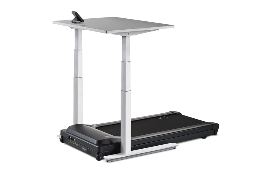 Adjustable height desk treadmill with black belt, gray work surface, white steel frame, and black control panel on white back