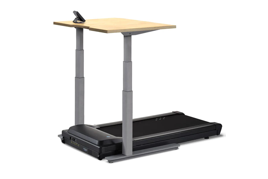 Adjustable height standing desk treadmill with natural wood top, gray metal frame, and black treadmill base with control pane