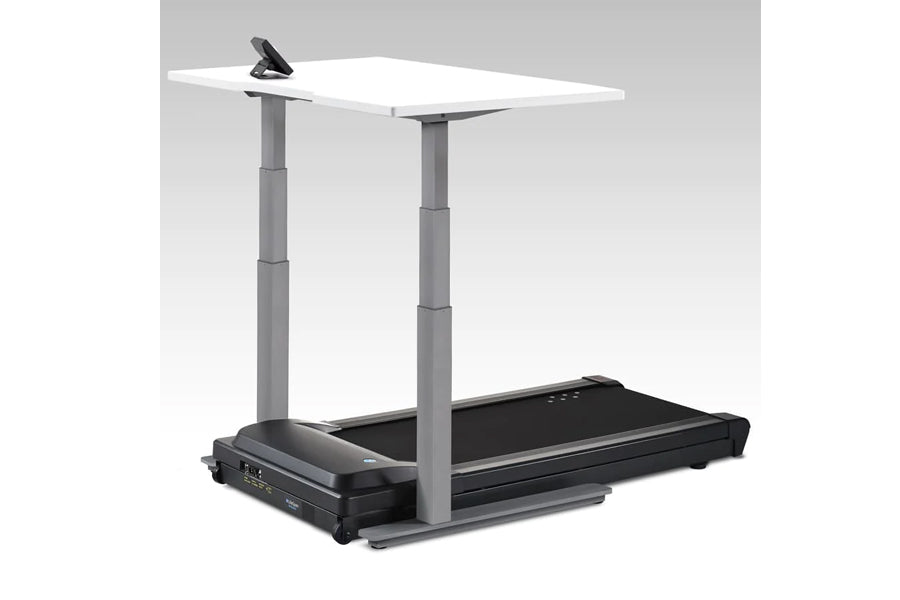 Height-adjustable desk treadmill with white top, gray legs, and black belt base on gray background
