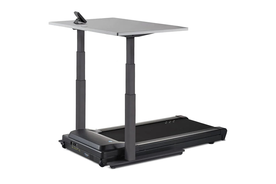 Black LifeSpan treadmill with gray desktop work surface and adjustable height columns, shown on white background