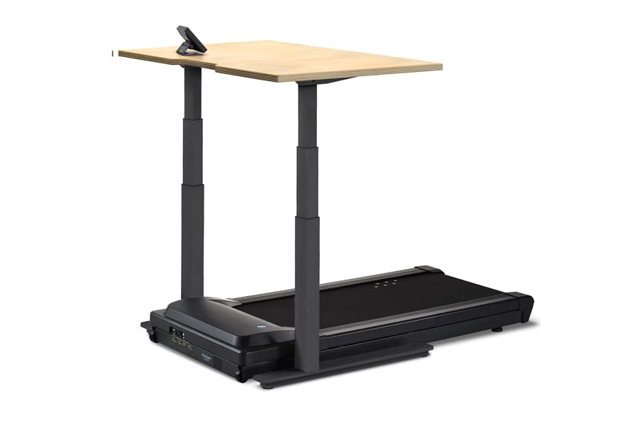 Adjustable height desk treadmill with light wood top, black frame, and built-in treadmill base on white background