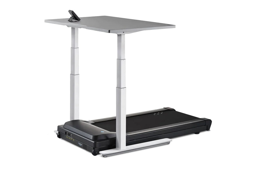 LifeSpan TR1000-Omni desk treadmill with black running belt, gray desk surface, and white adjustable metal frame on white bac