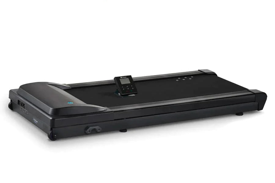 Black under-desk treadmill with curved motor housing on left, black walking surface, digital control panel mounted on top, an