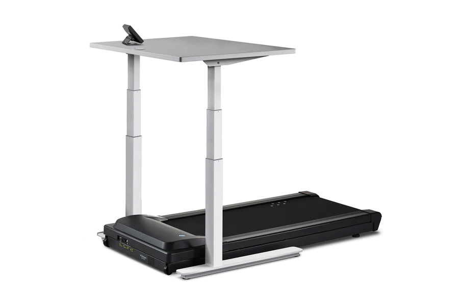 Black treadmill with adjustable gray desk surface and white metal frame, featuring control panel and tablet holder on desktop