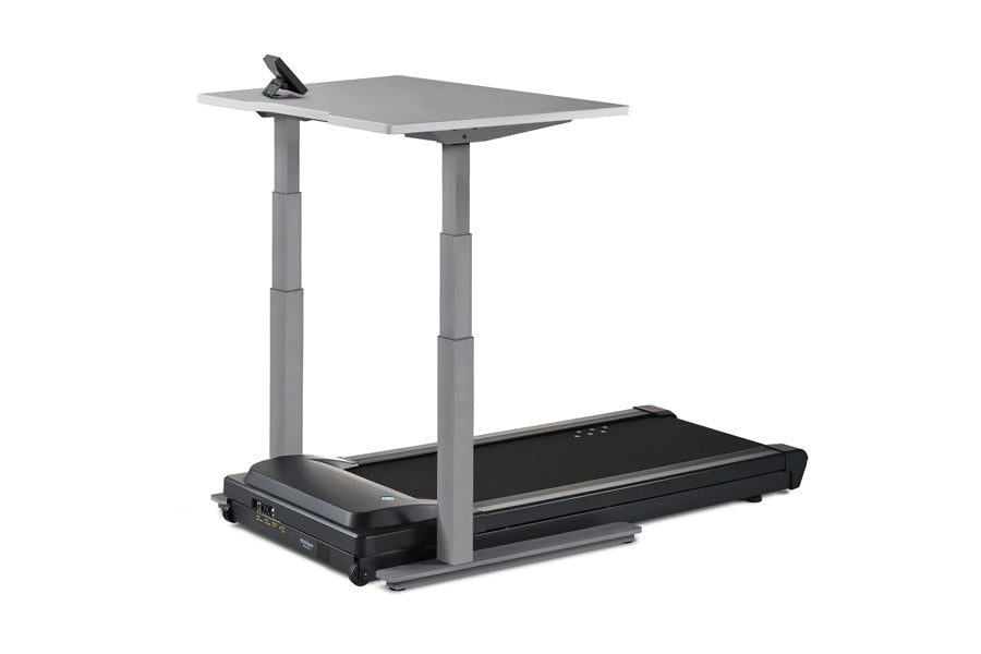 Gray and black motorized treadmill desk with adjustable height gray columns, black running surface, and gray desktop work sur