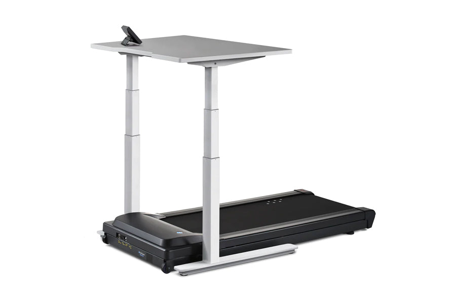 LifeSpan TR1200-Omni black treadmill with gray standing desk surface and white adjustable base on white background