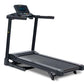 Black folding treadmill with digital display console, handrails, and cushioned running deck on white background