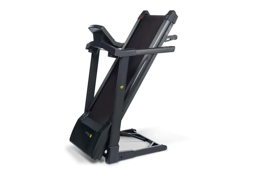 Black folding treadmill with gray accents, digital display panel, and handrails on white background