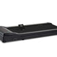Black under-desk treadmill with curved motor housing on left, black running belt, digital control panel, and gray trim on whi